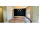 Open-concept living room features a modern light fixture, and new patio doors at 1801 Griffith Ave, Las Vegas, NV 89104