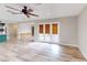 Bright living room with wood-look floors and doors that lead to an outdoor area at 1801 Griffith Ave, Las Vegas, NV 89104