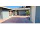 Private outdoor patio with gray siding and space for entertaining at 1801 Griffith Ave, Las Vegas, NV 89104
