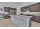 Stylish kitchen with granite countertops, a large island, stainless steel appliances, and ample cabinet space at 2494 Veronella St, Henderson, NV 89044