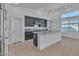 Clean, contemporary kitchen featuring an island with granite countertops, ample storage, and modern appliances at 2494 Veronella St, Henderson, NV 89044