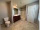Bathroom with dual sink vanity, tub and toilet at 2664 Frabiele St, Henderson, NV 89044