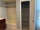 Bright bathroom featuring a shower-tub combination and convenient linen closet at 2664 Frabiele St, Henderson, NV 89044
