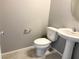 Well-lit powder room with pedestal sink and modern toilet at 2664 Frabiele St, Henderson, NV 89044
