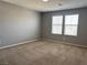 Spacious bedroom with natural light and neutral carpet at 2664 Frabiele St, Henderson, NV 89044