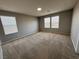 Expansive bedroom with plush carpeting and multiple windows at 2664 Frabiele St, Henderson, NV 89044