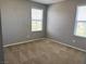 Comfortable bedroom filled with natural light from two windows at 2664 Frabiele St, Henderson, NV 89044