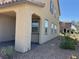 Two-story home featuring a covered patio area for outdoor relaxation and desert-style landscaping at 2664 Frabiele St, Henderson, NV 89044
