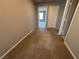 Hallway with carpet, doors, and neutral walls at 2664 Frabiele St, Henderson, NV 89044