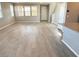 Bright and airy living room with wood-look flooring, offering a versatile space for entertaining and relaxation at 2664 Frabiele St, Henderson, NV 89044