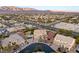 Spacious home with beautiful landscaping and a view of mountains in the background at 6004 Chessington Ave, Las Vegas, NV 89131