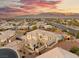 Expansive aerial view of property, highlighting landscaping and a custom pool with rocky waterfall feature at 6004 Chessington Ave, Las Vegas, NV 89131
