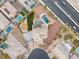 Bird's eye view of landscaped backyard, pool, and the house with circular driveway at 6004 Chessington Ave, Las Vegas, NV 89131