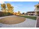 Spacious backyard featuring a custom outdoor kitchen and plenty of room for recreation at 6004 Chessington Ave, Las Vegas, NV 89131