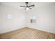 Bright bedroom with hardwood floors, a ceiling fan, and windows at 6004 Chessington Ave, Las Vegas, NV 89131