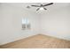 Bright bedroom with hardwood floors, a ceiling fan, and window with blinds at 6004 Chessington Ave, Las Vegas, NV 89131