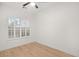 Bright bedroom with hardwood floors and window with blinds at 6004 Chessington Ave, Las Vegas, NV 89131