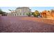 Large home with desert landscaping, a luxurious pool, and a great outdoor kitchen at 6004 Chessington Ave, Las Vegas, NV 89131