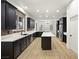 Bright kitchen features stainless steel appliances, an island, and sleek cabinetry at 6004 Chessington Ave, Las Vegas, NV 89131