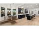Eat-in kitchen area features a table, chairs, and a view of the backyard at 6004 Chessington Ave, Las Vegas, NV 89131