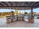 Spacious outdoor kitchen equipped with stainless steel appliances and ample counter space at 6004 Chessington Ave, Las Vegas, NV 89131