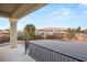 Inviting outdoor covered patio area overlooking the backyard with mountain views in the distance at 6004 Chessington Ave, Las Vegas, NV 89131