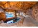 Unique backyard spa and grotto featuring a tranquil escape, enhancing the outdoor living space at 6004 Chessington Ave, Las Vegas, NV 89131