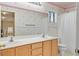 Bathroom with double vanity, large mirror, and shower-tub combination at 681 Peach Coral St, Las Vegas, NV 89183