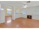 Open-concept living space featuring a fireplace and hardwood floors offering design possibilities at 681 Peach Coral St, Las Vegas, NV 89183