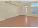 Spacious living room featuring high ceilings and hardwood floors, awaiting personal touches at 681 Peach Coral St, Las Vegas, NV 89183