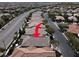 An aerial view of a single-Gathering home with a tile roof in a residential neighborhood at 7806 Sundial Peak St, Las Vegas, NV 89166