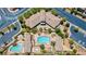 Aerial view of community pool area with a large pool, covered seating, and landscaping at 7806 Sundial Peak St, Las Vegas, NV 89166