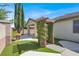 The backyard includes a pergola, covered patio and spa at 7806 Sundial Peak St, Las Vegas, NV 89166