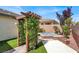 Landscaped backyard with a pergola and spa at 7806 Sundial Peak St, Las Vegas, NV 89166