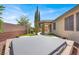This backyard features a pergola and spa at 7806 Sundial Peak St, Las Vegas, NV 89166