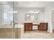 Elegant bathroom with a glass-enclosed shower, a soaking tub, and dual wood vanities at 7806 Sundial Peak St, Las Vegas, NV 89166