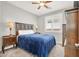 Comfortable bedroom featuring a ceiling fan and a window for natural light at 7806 Sundial Peak St, Las Vegas, NV 89166