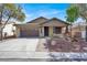 Charming single-story home featuring a well-manicured front yard and a two car garage at 7806 Sundial Peak St, Las Vegas, NV 89166