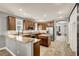 Spacious kitchen with granite countertops, stainless steel appliances, and a central island at 7806 Sundial Peak St, Las Vegas, NV 89166