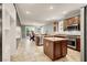 Modern kitchen with stainless steel appliances, granite countertops, and central island at 7806 Sundial Peak St, Las Vegas, NV 89166