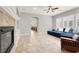 Open living area with tile floors, fireplace, and comfortable seating, perfect for gatherings at 7806 Sundial Peak St, Las Vegas, NV 89166
