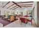 Inviting lounge area features high ceilings, exposed beams, and comfortable seating, ideal for relaxation at 7806 Sundial Peak St, Las Vegas, NV 89166