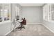 Home office featuring two shuttered windows, neutral paint, and modern furnishings at 7806 Sundial Peak St, Las Vegas, NV 89166