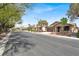 A street view showcases this home with mature landscaping at 7806 Sundial Peak St, Las Vegas, NV 89166