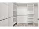 Bright, spacious walk-in closet with built-in shelving and hanging rods for organized storage at 7806 Sundial Peak St, Las Vegas, NV 89166