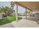 Beautiful backyard with covered patio, artificial turf, and refreshing pool at 7829 Lovely Pine Pl, Las Vegas, NV 89143