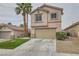 Charming exterior of a two-story home with desert landscaping and a two-car garage at 7829 Lovely Pine Pl, Las Vegas, NV 89143