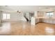Spacious living room features stairs, tile flooring, and kitchen access at 7829 Lovely Pine Pl, Las Vegas, NV 89143