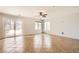 Spacious living room with tile flooring and a sliding glass door leading to a pool at 7829 Lovely Pine Pl, Las Vegas, NV 89143