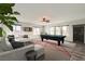 Game room featuring a pool table, lounge area, and natural light at 7829 Lovely Pine Pl, Las Vegas, NV 89143